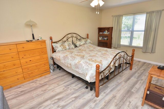 557 SE Seahouse Dr, Port Saint Lucie, FL 34983 - bedroom with baseboards, ceiling fan, and wood finished floors