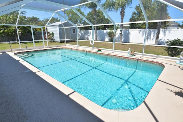 557 SE Seahouse Dr, Port Saint Lucie, FL 34983 - view of pool with a lanai, a patio, a fenced backyard, and a fenced in pool