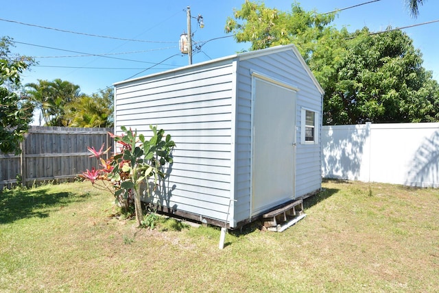 557 SE Seahouse Dr, Port Saint Lucie, FL 34983 - view of shed with a fenced backyard