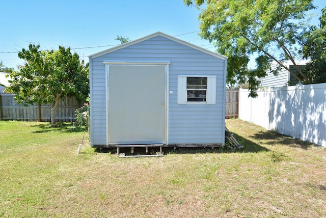 557 SE Seahouse Dr, Port Saint Lucie, FL 34983 - view of shed with a fenced backyard