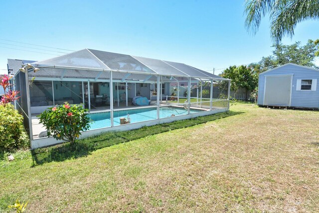 557 SE Seahouse Dr, Port Saint Lucie, FL 34983 - pool featuring a storage shed, a yard, an outdoor structure, and glass enclosure
