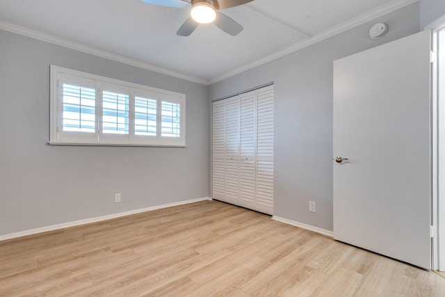 308 Golfview Rd Unit Ph02, North Palm Beach, FL 33408 - unfurnished bedroom featuring baseboards, wood finished floors, a closet, and crown molding
