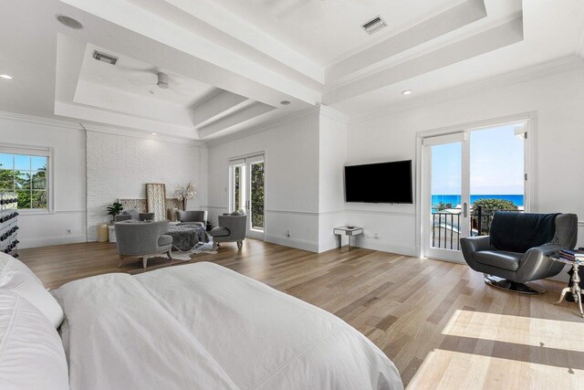 6080 Old Ocean Blvd, Ocean Ridge, FL 33435 - bedroom featuring a tray ceiling, access to exterior, wood finished floors, crown molding, and recessed lighting