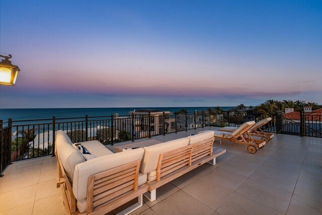 6080 Old Ocean Blvd, Ocean Ridge, FL 33435 - patio terrace at dusk with an outdoor living space and a water view