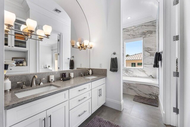 6080 Old Ocean Blvd, Ocean Ridge, FL 33435 - full bathroom featuring a freestanding tub, crown molding, and vanity