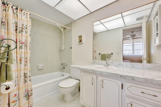 ensuite bathroom featuring vanity, shower / tub combo with curtain, toilet, tile patterned floors, and ceiling fan