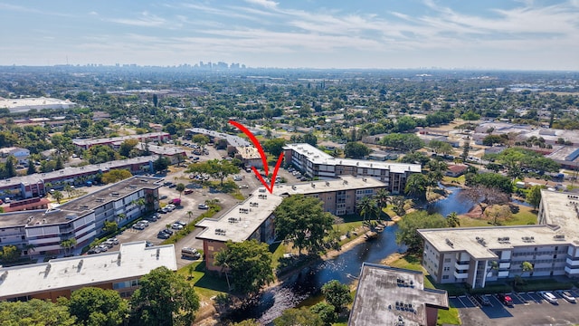 aerial view featuring a water view and a view of city