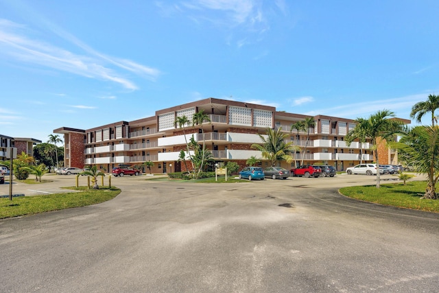 view of property with uncovered parking