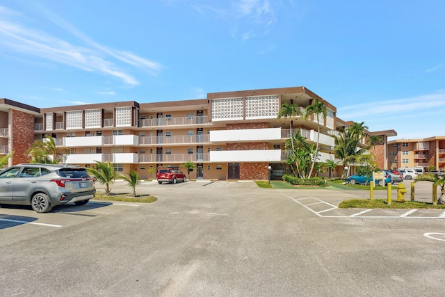 view of property with uncovered parking