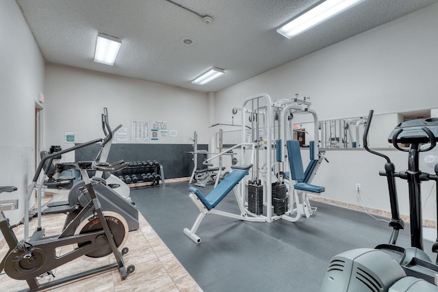 workout area featuring a textured ceiling