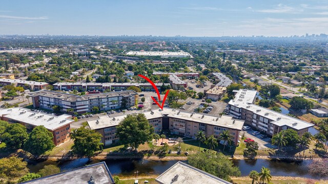 bird's eye view featuring a water view and a city view