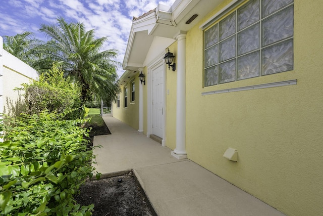 view of side of property with stucco siding