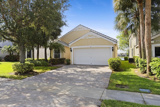 154 Berenger Walk, Royal Palm Beach, FL 33414 - ranch-style home with stucco siding, decorative driveway, a garage, central AC unit, and a front lawn