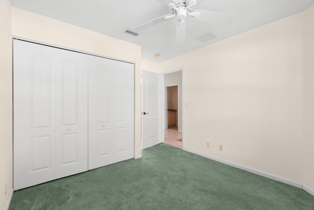 154 Berenger Walk, Royal Palm Beach, FL 33414 - unfurnished bedroom with carpet floors, a closet, baseboards, and a ceiling fan
