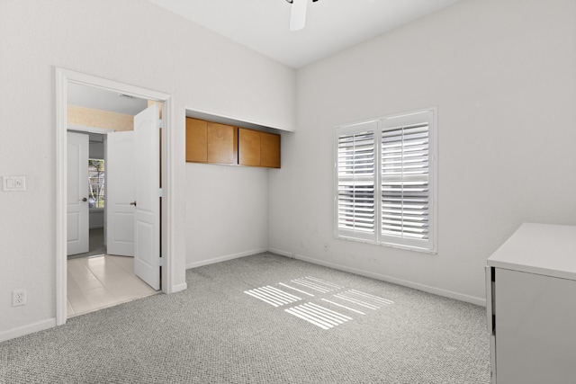 154 Berenger Walk, Royal Palm Beach, FL 33414 - unfurnished bedroom with light carpet, multiple windows, and baseboards
