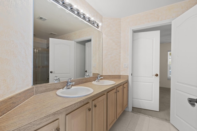 154 Berenger Walk, Royal Palm Beach, FL 33414 - bathroom featuring double vanity, a shower with shower door, and tile patterned flooring
