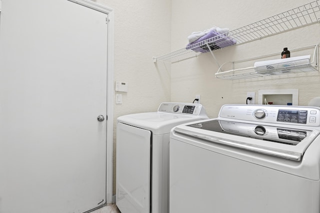154 Berenger Walk, Royal Palm Beach, FL 33414 - washroom featuring independent washer and dryer and a textured wall