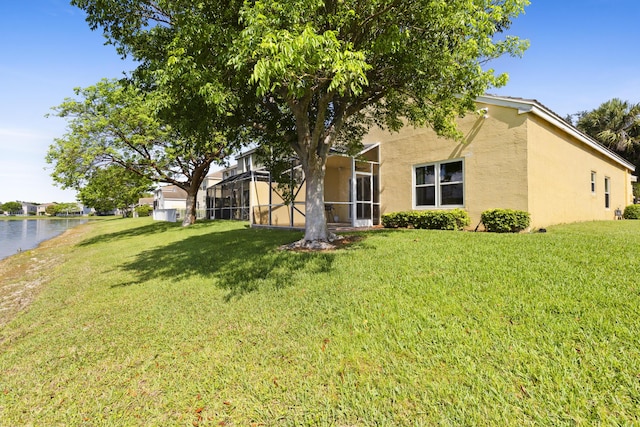 154 Berenger Walk, Royal Palm Beach, FL 33414 - view of front facade with stucco siding, a front yard, and a water view