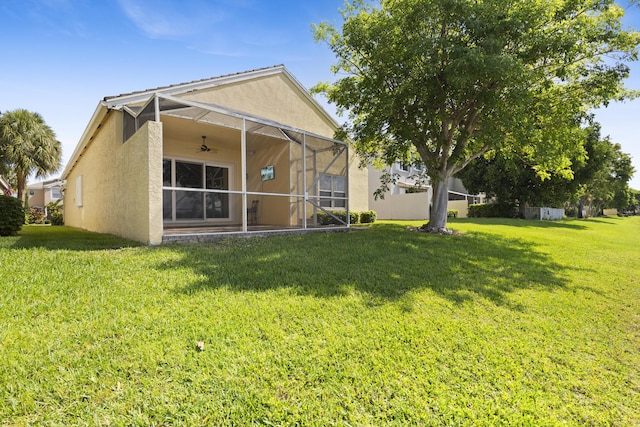 154 Berenger Walk, Royal Palm Beach, FL 33414 - back of property with stucco siding, ceiling fan, and a yard