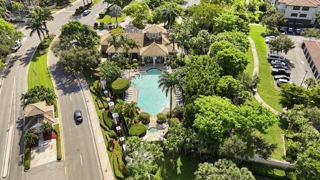 154 Berenger Walk, Royal Palm Beach, FL 33414 - drone / aerial view of a pool and a tree filled landscape