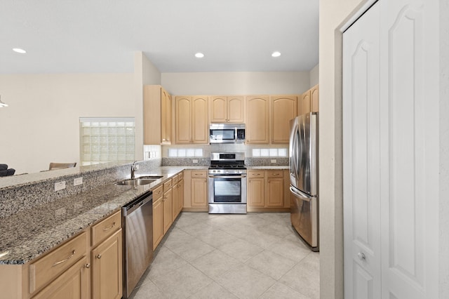154 Berenger Walk, Royal Palm Beach, FL 33414 - kitchen with appliances with stainless steel finishes, light brown cabinets, a sink, light stone counters, and light tile patterned flooring