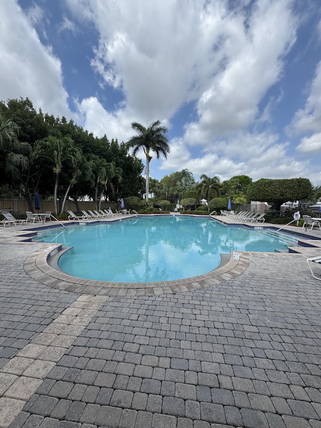 154 Berenger Walk, Royal Palm Beach, FL 33414 - community pool with a patio