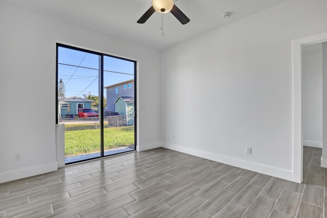 311 Ocean Pkwy, Boynton Beach, FL 33435 - spare room with wood tiled floor, baseboards, and ceiling fan