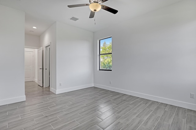 311 Ocean Pkwy, Boynton Beach, FL 33435 - unfurnished room with visible vents, baseboards, ceiling fan, and wood tiled floor