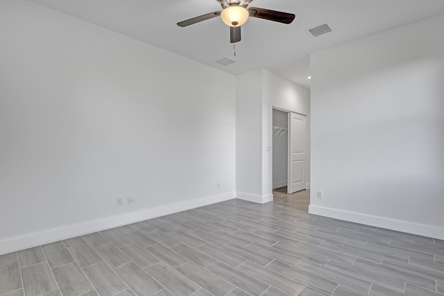 311 Ocean Pkwy, Boynton Beach, FL 33435 - spare room featuring light wood-style floors, baseboards, visible vents, and ceiling fan