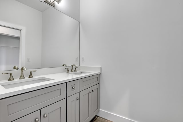 311 Ocean Pkwy, Boynton Beach, FL 33435 - bathroom with double vanity, baseboards, and a sink