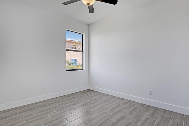 311 Ocean Pkwy, Boynton Beach, FL 33435 - empty room featuring baseboards, ceiling fan, and wood tiled floor