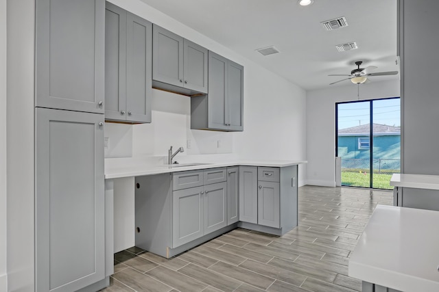311 Ocean Pkwy, Boynton Beach, FL 33435 - kitchen featuring a sink, visible vents, gray cabinets, and ceiling fan
