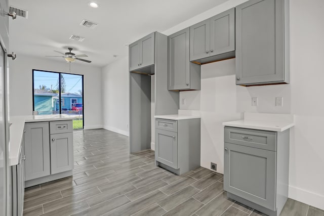 311 Ocean Pkwy, Boynton Beach, FL 33435 - kitchen featuring visible vents, a ceiling fan, and gray cabinets