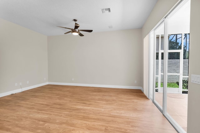 13594 Morocca Lake Ln, Delray Beach, FL 33446 - unfurnished room with ceiling fan, light wood-style floors, and baseboards