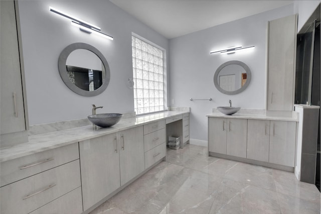 13594 Morocca Lake Ln, Delray Beach, FL 33446 - bathroom featuring marble finish flooring, two vanities, and baseboards
