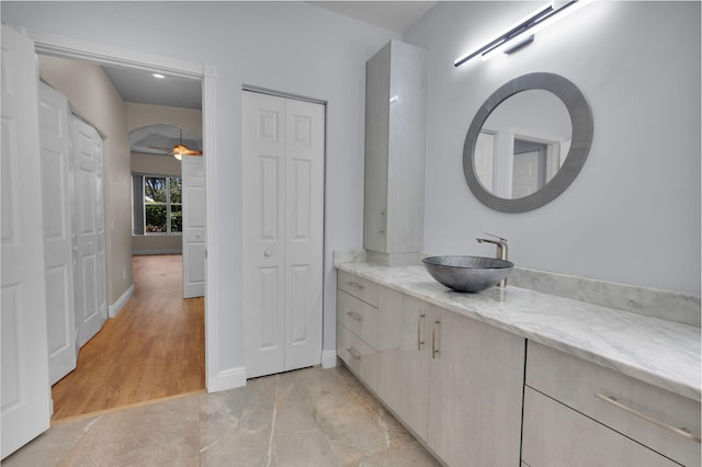 13594 Morocca Lake Ln, Delray Beach, FL 33446 - bathroom with vanity, a closet, a ceiling fan, and baseboards