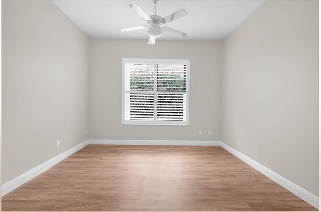 13594 Morocca Lake Ln, Delray Beach, FL 33446 - spare room with light wood-style floors, a ceiling fan, and baseboards