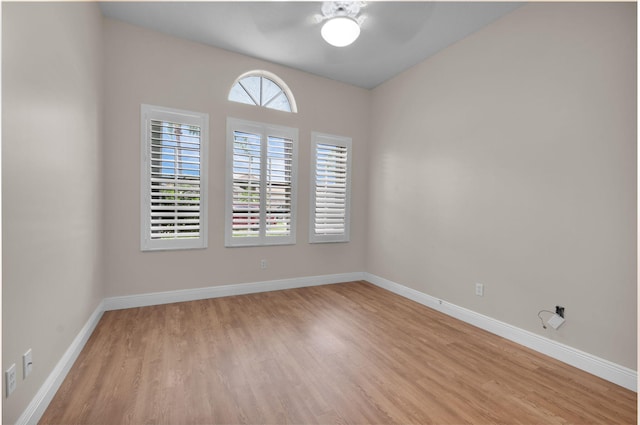 13594 Morocca Lake Ln, Delray Beach, FL 33446 - spare room featuring ceiling fan, light wood finished floors, and baseboards