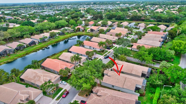 bird's eye view with a residential view and a water view