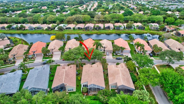 bird's eye view featuring a residential view and a water view
