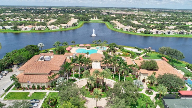 birds eye view of property featuring a water view and a residential view
