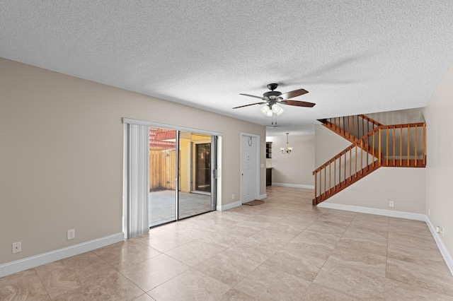 9940 NW 6th Pl, Plantation, FL 33324 - unfurnished living room featuring a ceiling fan, baseboards, a textured ceiling, and stairs