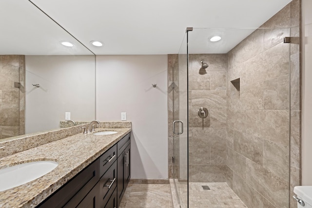 9940 NW 6th Pl, Plantation, FL 33324 - full bathroom with a shower stall, a sink, double vanity, and recessed lighting
