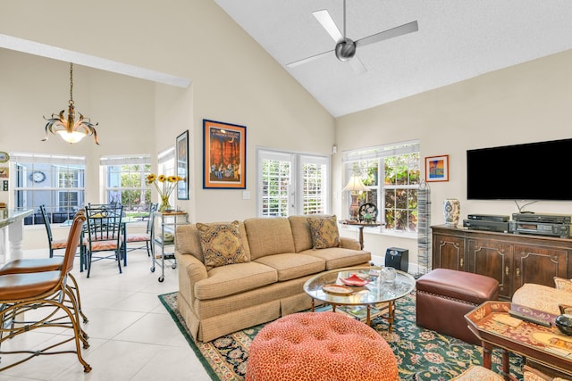 6106 Vista Linda Ln, Boca Raton, FL 33433 - living area with light tile patterned floors, high vaulted ceiling, plenty of natural light, and ceiling fan with notable chandelier