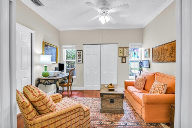 6106 Vista Linda Ln, Boca Raton, FL 33433 - living area with visible vents, a ceiling fan, a textured ceiling, crown molding, and wood finished floors