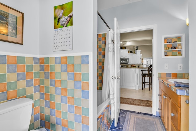 6106 Vista Linda Ln, Boca Raton, FL 33433 - full bathroom with vanity, tile patterned flooring, toilet, tile walls, and shower / bath combo with shower curtain