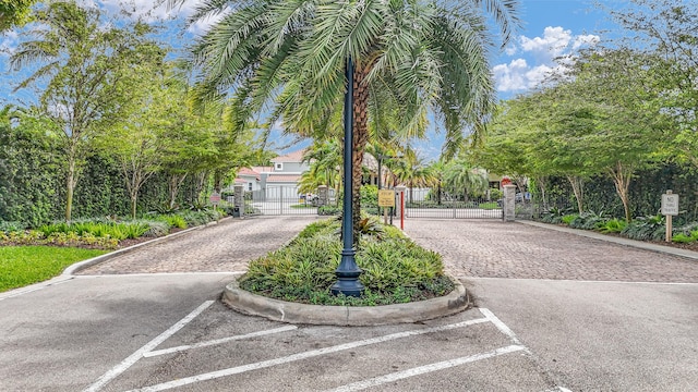 6106 Vista Linda Ln, Boca Raton, FL 33433 - view of street featuring a gated entry, curbs, and a gate