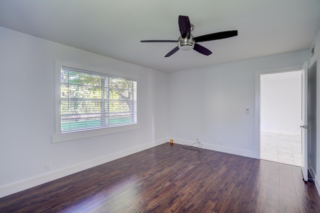 140 Lake Meryl Dr Unit 133, West Palm Beach, FL 33411 - unfurnished room featuring dark wood-type flooring, a ceiling fan, and baseboards