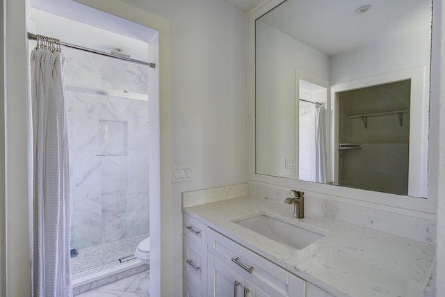 140 Lake Meryl Dr Unit 133, West Palm Beach, FL 33411 - full bathroom featuring vanity, marble look tile flooring, a stall shower, and toilet