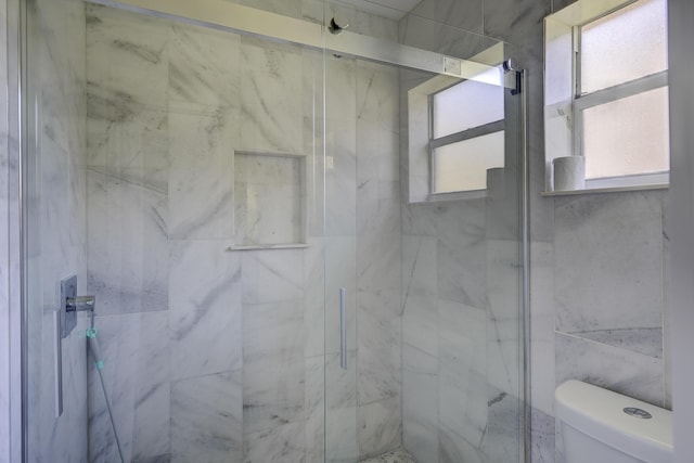 140 Lake Meryl Dr Unit 133, West Palm Beach, FL 33411 - full bathroom with a marble finish shower and toilet